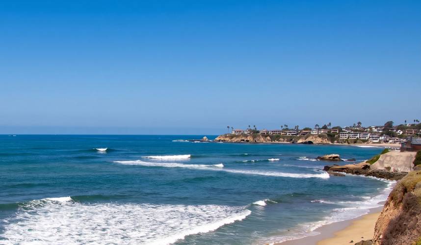 Birdrock surf break in La Jolla, San Diego — sets peeling across the reef below the horizon.