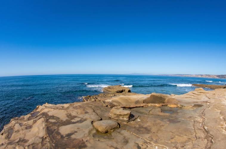 Hogans surf break in La Jolla, San Diego — waves wrapping the point over the reef shelf.